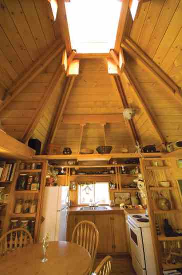 The vaulted ceiling's skylight bathes the home in light.